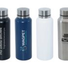Four reusable bottles with various designs and logos are displayed in a row. The colors are black, blue, white, and silver, each featuring distinct branding and text.