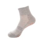 A gray sock with a short cuff and an orange non-slip grip pattern on the sole, shown against a white background.