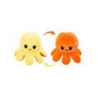 Two plush octopus toys are shown. The left one is yellow with a happy expression, and the right one is orange with a frowning face. Curved arrows between them suggest they can be flipped to change the expression.
