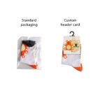 Comparison of sock packaging: on the left, socks in clear plastic with Standard packaging text; on the right, socks with an orange bear-themed custom header card labeled Custom header card.