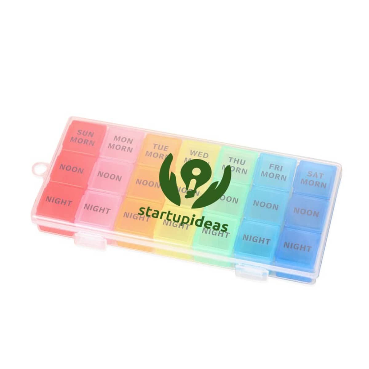 A weekly pill organizer with rainbow-colored compartments labeled for morning, noon, and night from Sunday to Saturday. It has a clear plastic lid and the text startupideas with a lightbulb icon overlaying the image.