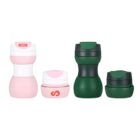 Four stackable travel containers shown in two colors: pink and green. Each color set includes a smaller and larger container. All containers have screw-on lids, with one pink lid marked with a red logo.