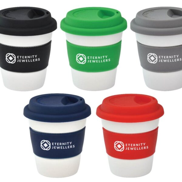Five reusable coffee cups with silicone lids and sleeves in black, green, gray, navy, and red. Each sleeve is labeled Eternity Jewellers. The cups are arranged in a two-top and three-bottom row format.