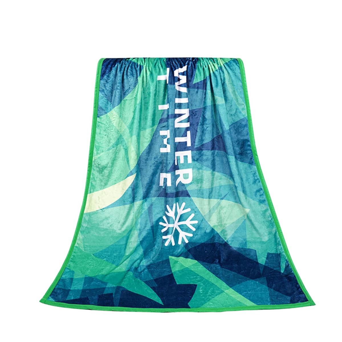 A fleece blanket with abstract green and blue geometric patterns. The words Winter Time and a snowflake design are printed vertically in white. The blanket has a light green trim around the edges.