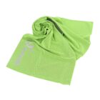 A bright green sports towel with a subtle dotted texture, partially folded with the brand logo visible.