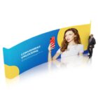 A large display banner showing a woman holding a red smartphone against a blue and yellow background. The text on the banner reads Convenient Unlocking. A man in a suit stands nearby for scale.