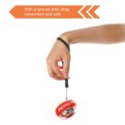 A hand is holding a gyroscopic wrist ball exercise tool with a red band and black wrist strap. The text above reads, With a special wrist strap, convenient and safe.