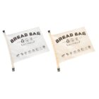 Two reusable bread bags, one white and one beige, side by side. Each bag has BREAD BAG and REUSABLE printed on it, along with various eco-friendly icons. They have black clips for sealing.