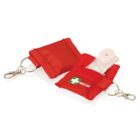 Red keychain pouches with first aid logos, each containing a clear mouthpiece for resuscitation. The pouches have metal clips for attachment.