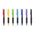 Seven ballpoint pens with colored clips and tips—red, yellow, green, light blue, blue, purple, and black—lined up in a row. Each pen has a black grip and body. The pens stand on their tips.