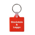 A red square keychain with a metal ring attachment. The keychain features white text that reads Stockdale & Leggo.