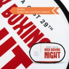 Close-up of a circular sign with red and white text advertising a Kick Boxing Night. An overlay reads, Durable Quality fabric and frame material. A smaller, similar shaped object with the same text is in front of the circular sign.