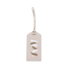 A rectangular beige luggage tag with a cut-out design. The tag has a looped strap for attachment. The center cut-out forms abstract shapes. The background is plain white.