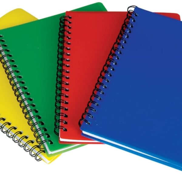 Four spiral-bound notebooks are arranged in a fan shape. The covers are yellow, green, red, and blue. They are stacked with their spines aligned on the left side.