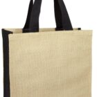A beige tote bag with black handles and black side panels, made of a rough-textured material. The bag is standing upright against a white background.