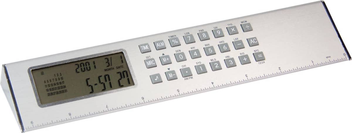A silver multifunctional digital ruler featuring a calculator and clock on the top surface. The ruler has a numerical keypad, various function buttons, and a small digital display showing the time and date.