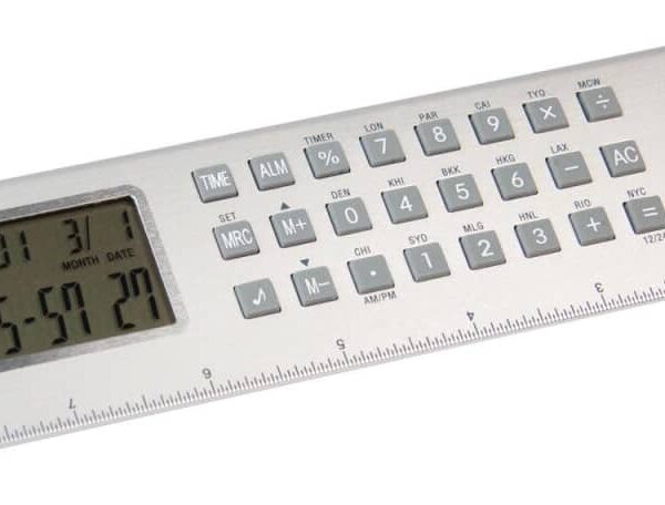 A multifunctional ruler featuring a calculator and digital clock display. The top section has various buttons and a small screen showing time, date, and calculations. The bottom edge acts as a measuring ruler.