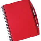A red spiral notebook with a smooth cover, accompanied by a red and silver ballpoint pen clipped to the right side. The pen is sleek with a metallic finish, complementing the vibrant color of the notebook.