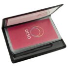 A small black cardholder is open, revealing a stack of cards. The top card is pink with a design of overlapping circles and the word orso printed on it.