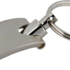 A metallic keychain with a sleek, rectangular fob featuring a small indentation near the top. The fob is connected to a round keyring by a short, smooth connector. The overall design is modern and minimalist.