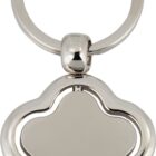 Close-up of a silver metal keychain with a flower-shaped pendant featuring smooth, rounded edges. The pendant has a minimalist design with a plain, reflective surface.