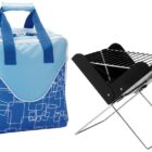 A blue and white insulated cooler bag with geometric patterns is next to a portable foldable metal barbecue grill with a black grate on top and silver legs.