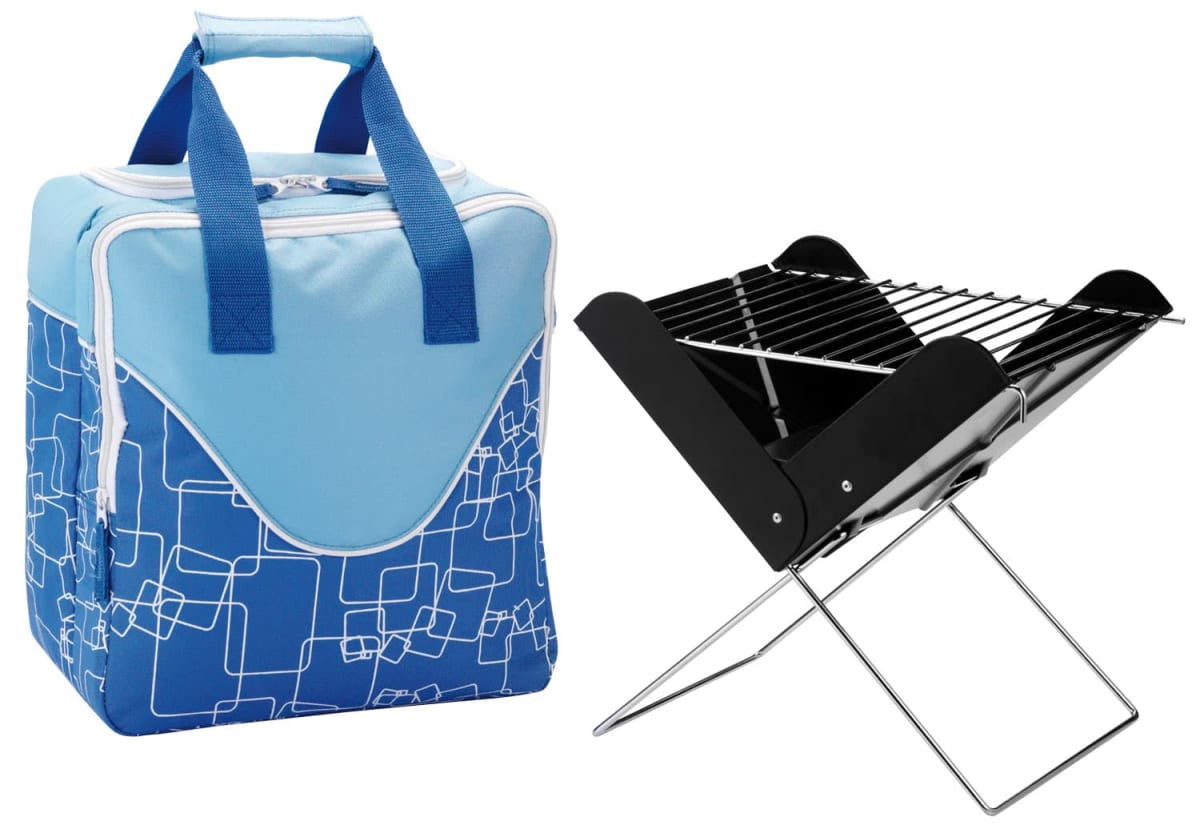 A blue and white insulated cooler bag with geometric patterns is next to a portable foldable metal barbecue grill with a black grate on top and silver legs.
