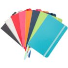 A variety of colorful notebooks fanned out on a white background. The notebooks have elastic bands and ribbon bookmarks. Colors include turquoise, lime green, orange, pink, red, white, light gray, and dark gray.