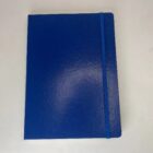 Blue hardcover notebook with a matching elastic band closure, placed on a white surface.