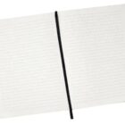 An open notebook showing lined pages. A black ribbon bookmark is placed in the middle, lying vertically across the pages. The notebook appears to have a white cover.