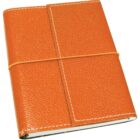 An orange leather-bound notebook with a textured cover and white stitching. It is secured with an elastic band wrapped around the center.