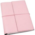 A closed pink leather journal with a textured surface is secured by an elastic band wrapped around it.