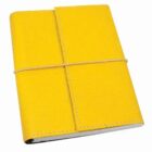 A closed journal with a bright yellow leather cover, secured with a matching yellow elastic band. The stitching is visible around the edges, creating a simple and neat appearance. The journal appears to be pocket-sized.