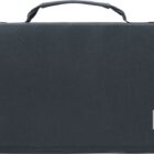 A black fabric carrying case with a handle on top. The case has a rectangular gray label in the lower right corner.