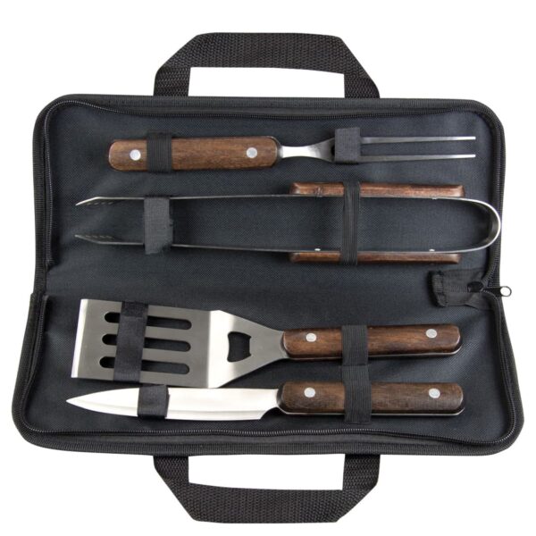 A black carrying case containing barbecue tools, including a spatula with a bottle opener, a fork, a knife, and tongs. The handles are made of wood, and the tools are secured with elastic straps.