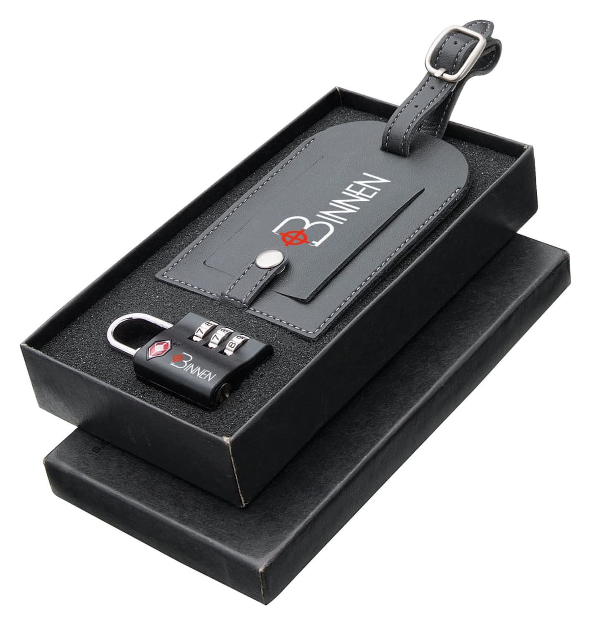 Black travel accessory gift set including a leather luggage tag with a buckle and a combination lock, both with a logo, presented in a foam-lined black box.