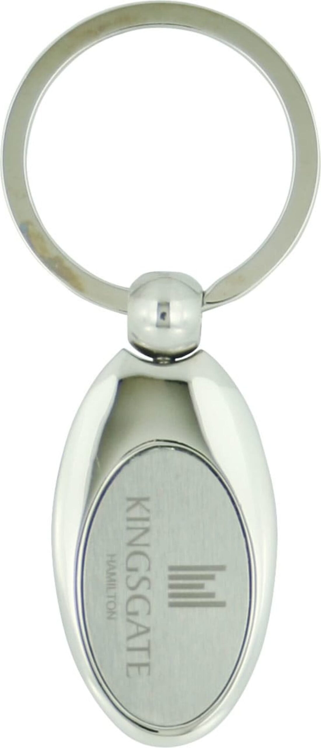 Silver oval keychain with an engraved panel. The panel features the text KINGSGATE and HAMILTON, along with a vertical line logo. The keychain has a smooth, shiny finish and a circular key ring attached.