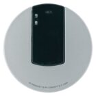 A round, silver electronic device with a black rectangular section on top, featuring a small dot and a lowercase g symbol. Labeled at the bottom edge: PF PRODUCT © PF CONCEPT B.V. 2006.