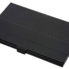 A black metal business card holder with a sleek, rectangular design. The surface features horizontal ridges, adding texture to its appearance. The holder is closed and resting on a white background.