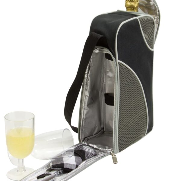 A black and silver insulated wine tote bag is open to reveal compartments and accessories. Beside it, a filled glass of white wine and an empty glass are displayed. The totes top is partially zipped, revealing a bottle with a cork.