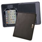 A black leather tablet case displaying an open view with a tablet inside, showing app icons on the screen. The opposite side of the case includes a slot or pocket. Another view shows the case closed, featuring a metallic logo plate.