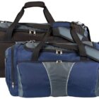 Two duffel bags with multiple compartments and zippers, one black with gray accents and the other blue with gray accents, are displayed side by side. Both bags have carrying handles and adjustable shoulder straps.