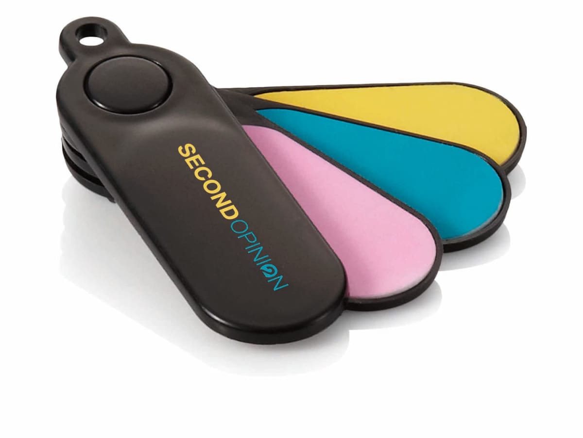 A black plastic device with four colorful swiveling blades—yellow, blue, pink, and black. The word SECONDOPINION is printed on the black blade. The blades have a round button at the pivot point.