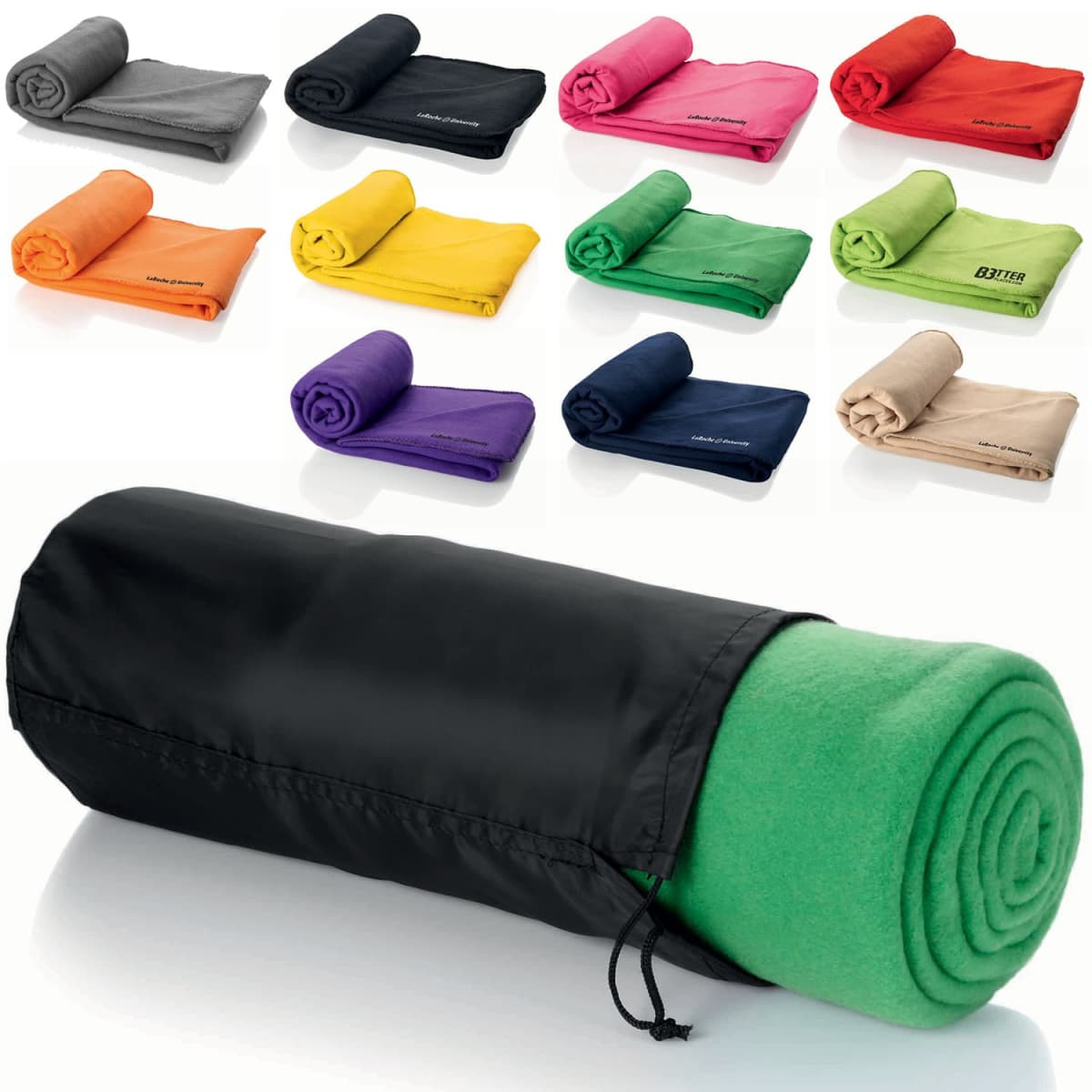 A variety of rolled fleece blankets in different colors (black, red, orange, yellow, green, purple, beige) are shown. One green blanket is partially unrolled and placed in a black carrying bag in the foreground.