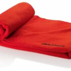 A rolled-up red blanket with La Roche University embroidered in black on one corner is displayed against a white background.