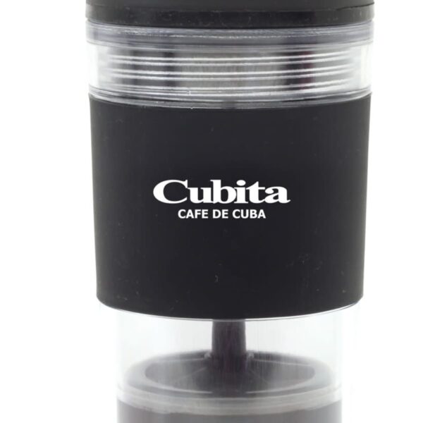 A black and transparent Cubita brand coffee grinder with a hand crank on top. The grinder has Café de Cuba written in white on the black section. The design is sleek and modern.