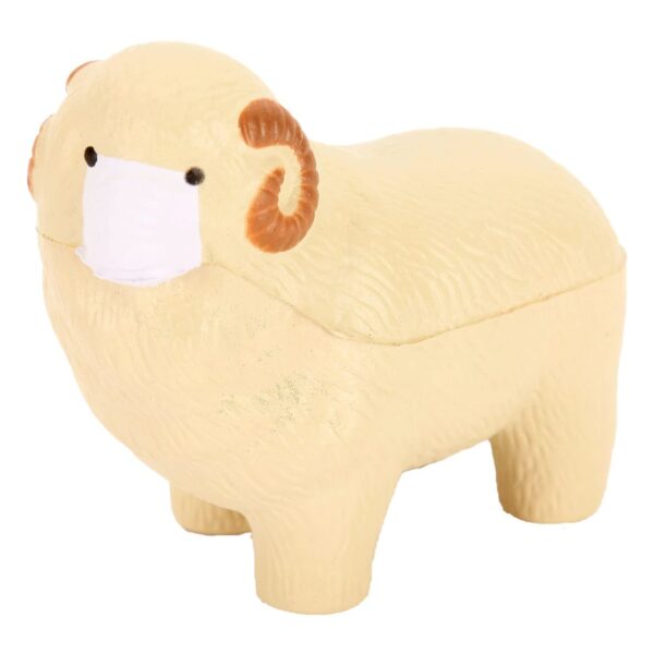 A small beige sheep figurine with curly brown horns wears a white face mask. The texture resembles wool, and it stands on four legs against a plain white background.