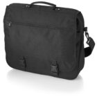 A black messenger bag with a top handle and an adjustable shoulder strap. The bag features a zippered pocket on the front flap, which is secured with two buckle clips. The design is simple and functional.