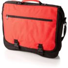 A red and black messenger bag with a handle and shoulder strap. It features a front zippered pocket and two buckle closures. The bags main body is red, while the trim and bottom are black.