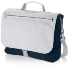 A two-tone messenger bag with a white flap and navy blue body. It features a zippered pocket on the flap, an adjustable shoulder strap, and a top handle. A silver buckle secures the flap.